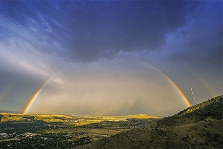 rainbow over mountains